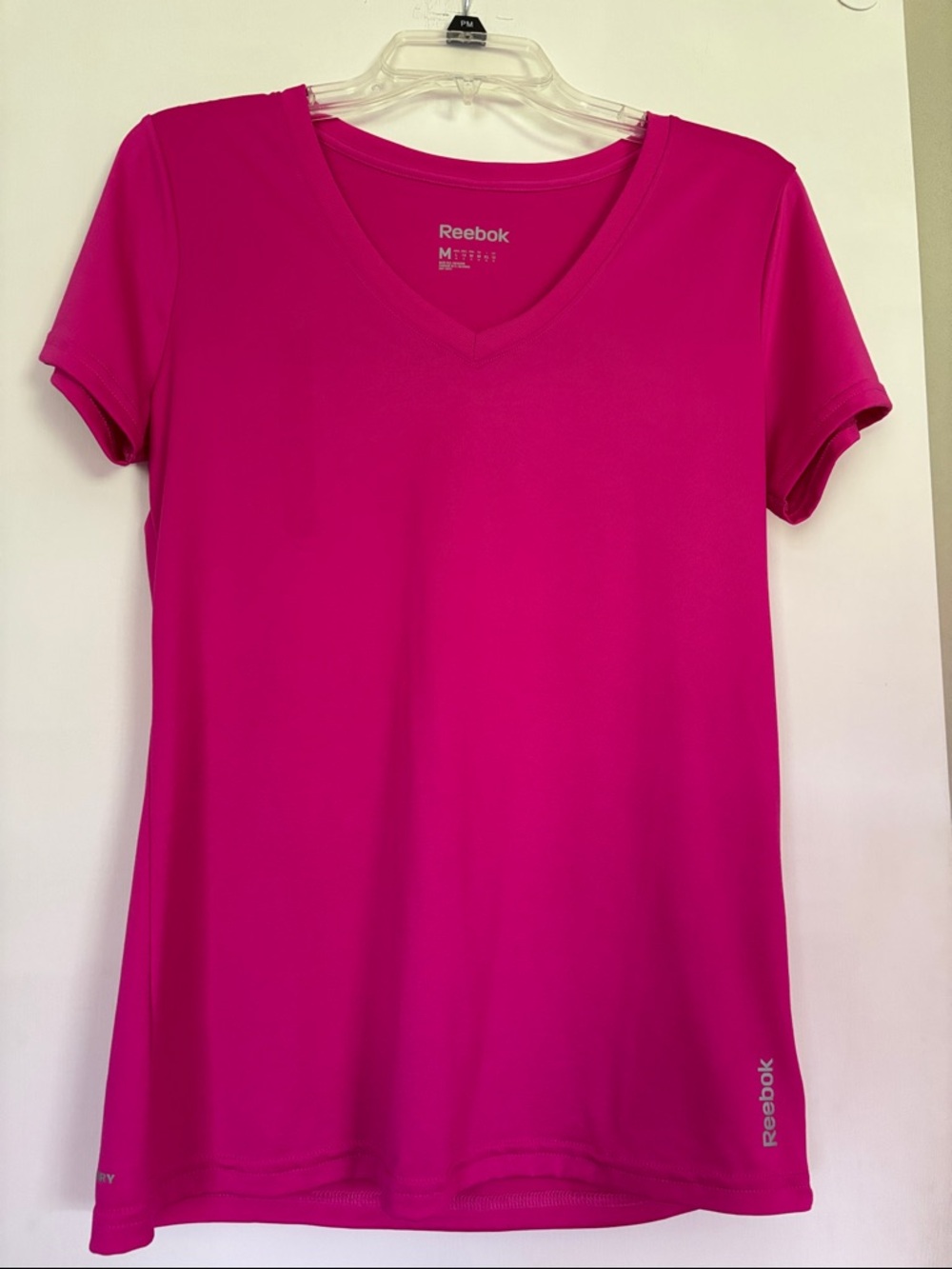 Reebok Women’s Short-Sleeve V-Neck Tee in Bright Fuchsia